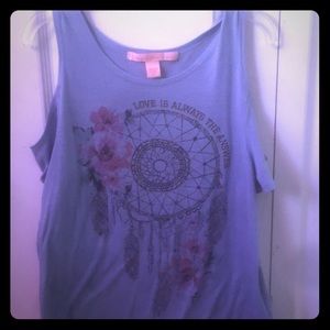 2 shirts showing shoulder from Rebellious.One